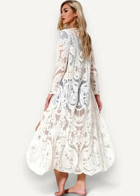 White lace kimono with flowing maxi dress style, intricate floral and paisley patterns, long sleeves, sheer overlay