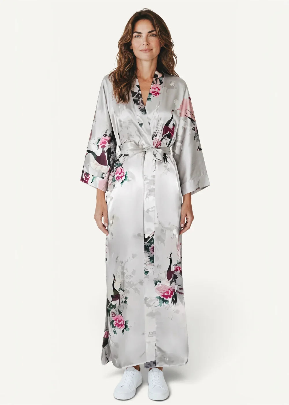 White silk robe in flowing silver satin with pink and black floral patterns and a belted waist with three quarter sleeves