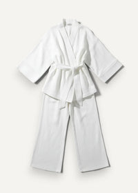 White women’s kimono pajamas featuring a white cotton robe with matching wide-leg pants tied at the waist