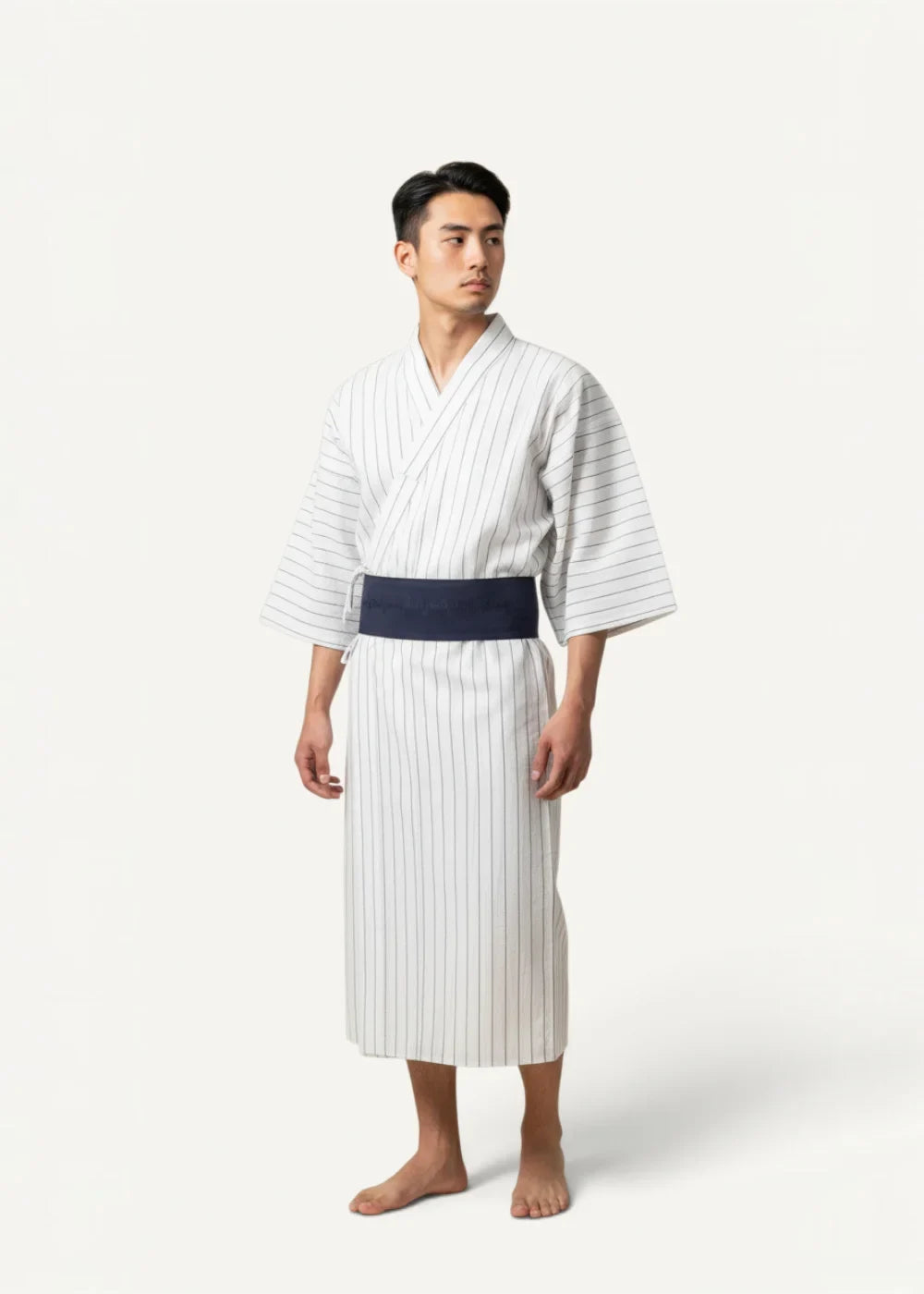 White yukata robe with fine navy blue vertical stripes and a solid navy blue obi belt