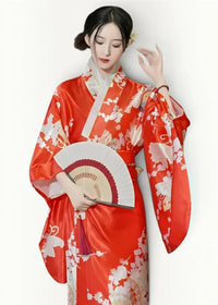 Women’s floral satin robe in vibrant red silk with delicate white and beige floral patterns and a traditional obi sash