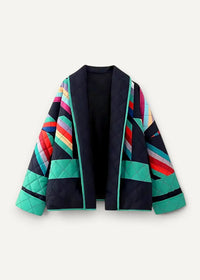 Women’s kimono jacket with a vibrant quilted design featuring bold teal red and multicolored geometric patterns on navy