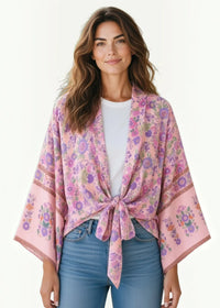 Women’s kimono top soft pink floral tie-front design with delicate purple and green blossoms along edges