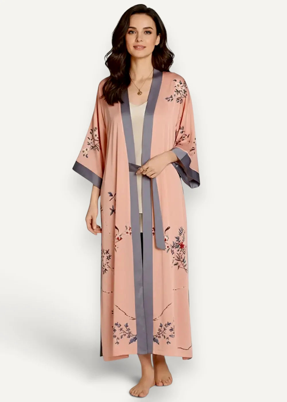 Women’s long kimono robe in soft peach with floral embroidery on sides and cuffs in muted purples and greens