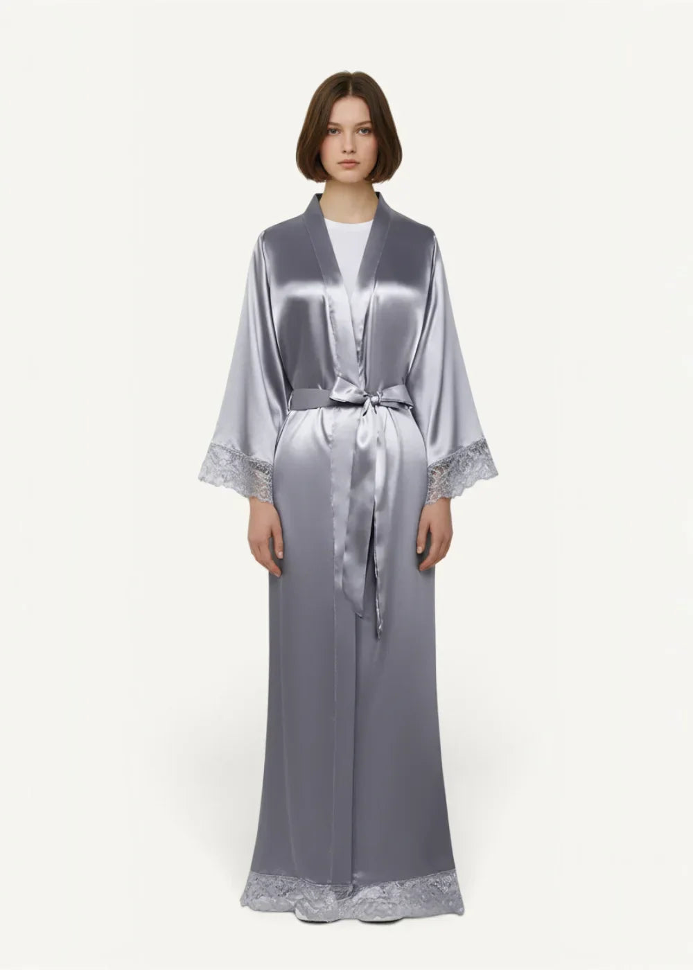 A sleek silver-gray satin women’s kimono robe with delicate lace trim at the cuffs and hem