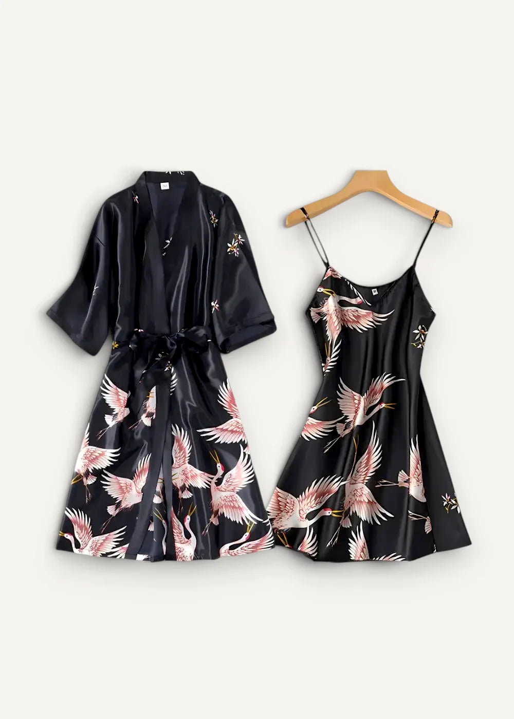 Women’s silk nightgown and robe set in black satin with elegant pink crane prints perfect for nighttime wear