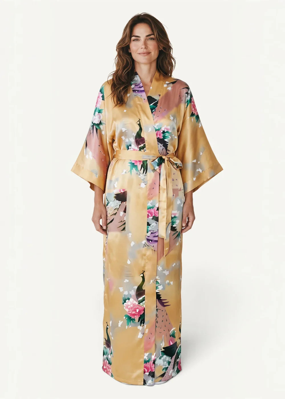 Yellow silk kimono robe with flowing golden satin fabric and vibrant peacock floral pattern in pink purple and green