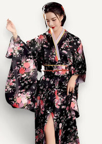 Black floral-patterned silk yukata robe with pink and white blossoms and gold-trimmed obi belt