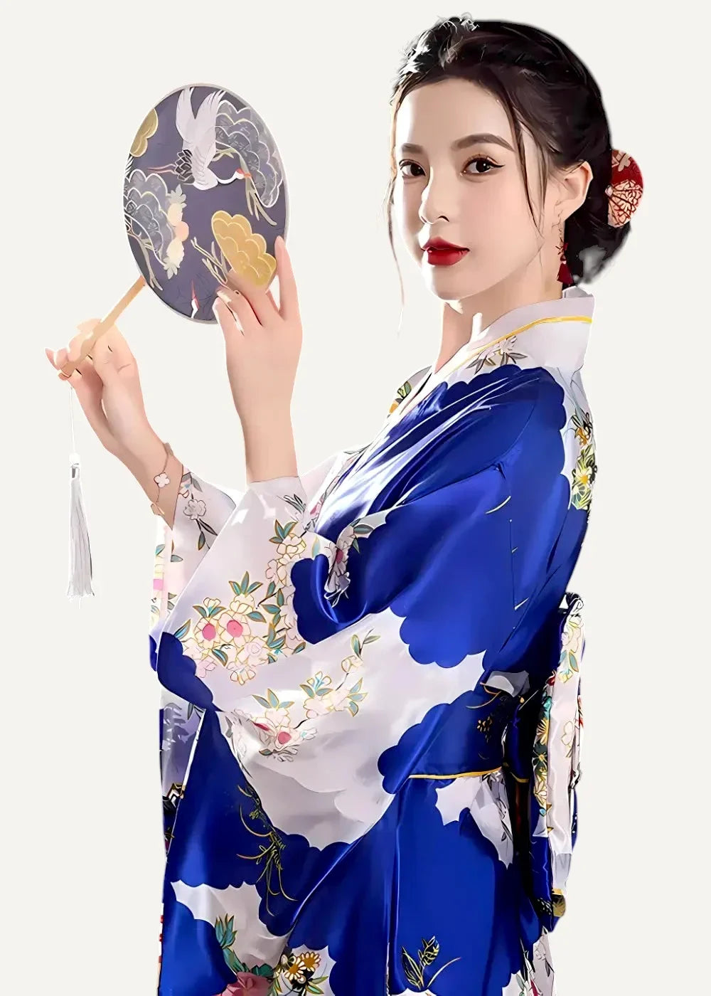 A woman wearing a vibrant blue and white silk floral embroidered yukata holding an ornate bird and cloud hand fan